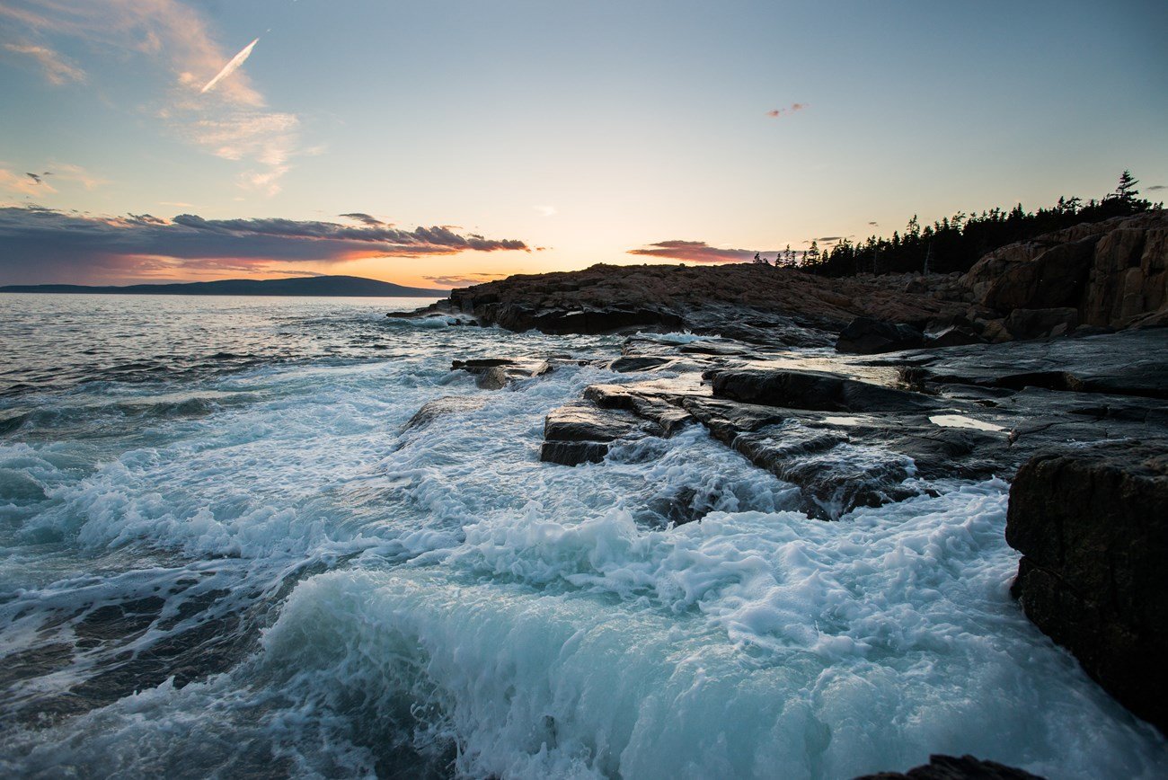 Ocean waves wash across the rocky coast at Schoodic Peninsula in Acadia.